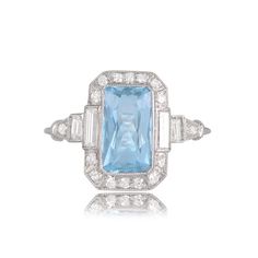 A delicate engagement ring, featuring a lively 1.70-carat rectangular aquamarine with a vivid teal saturation. The center stone is decorated with rows of old European cut diamonds and two baguette-cut diamonds following the shape perfectly. Fine milgrain and filigree add delicacy to the openwork lower gallery. The handmade platinum mounting is adorned with a lovely triple wire band. ✦ WHAT COMES IN YOUR SHIPMENT: - Your Engagement Ring - UGL Certificate - Quality Ring Box - Jewelry Cleaner ✦ WHY Cushion Cut Aquamarine Ring, Delicate Engagement Ring, Gemstone Rings Vintage, Vintage Cocktail Ring, Geometric Ring, Baguette Cut Diamond