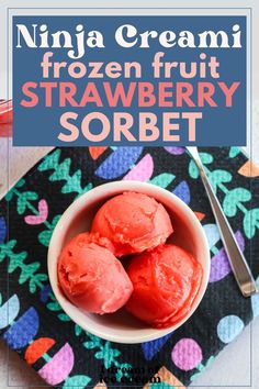 three scoops of frozen fruit strawberry sorbet in a white bowl on a colorful cloth