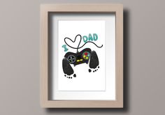 a framed print with the words dad and a video game controller