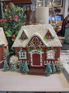 a gingerbread house with christmas decorations on it