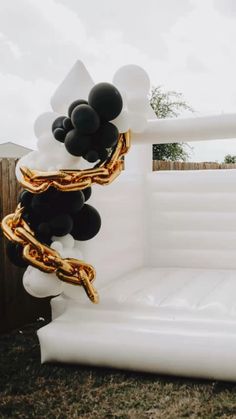 an inflatable balloon sculpture with black and white balloons