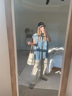 Oversized denim vest with clogs outfit Denim Vest Women Outfits, Denim Vest Oversized, Oversized Denim Dress, Long Jean Vest Outfits, Oversize Denim Vest Outfit, Denim Vest Jacket Outfit, Denim Jacket Outfit Oversized, Long Denim Vest Outfit, Oversized Vest Outfits For Women