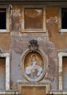 an ornate painting on the side of a building