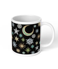 a coffee mug with stars and moon on it