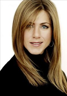 a woman with long blonde hair and blue eyes posing for a headshot in front of a white background