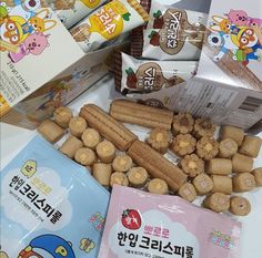 various snacks are displayed on a table with japanese characters in the backgroung