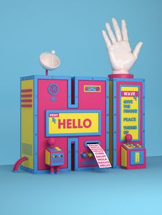 a pink and blue toy machine with two hands on top