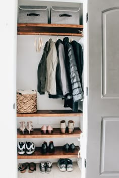 an open closet with shoes and other items