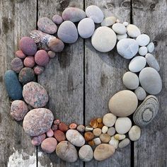 a circle made out of rocks sitting on top of a wooden floor