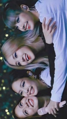 three young women are posing for a photo