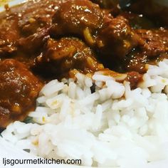 meat and rice on a plate with a spoon