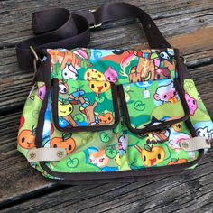 Tokidoki Le Sportsac Foresta Green Purse X Body Stellina Messenger Bag Kawaii Cartoon Rare Nylon Bag. 2 Exterior Flap Pockets. 1 Exterior Zipper Pocket. Rainbow Zipper Closure. 1 Inside Zipper Pocket. Adjustable Strap. Orange Lining. Measurements Are Approximate: Height - 9” (Not Including Strap) Width - 10” Depth - 5” No Stains, Rips, Tears, Or Holes. See Pictures For Additional Details Of Condition. Smoke Free Home. Kawaii Ideas, Green Purse, Kawaii Cartoon, Nylon Bag, Flap Pocket, Black Green, Cool Things, Diaper Bag, Messenger Bag