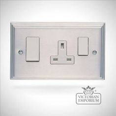 an image of a light switch plate with two lights on each side and the words victoria emporum above it