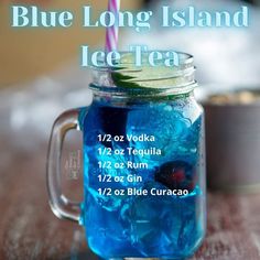 a blue drink in a mason jar on a table