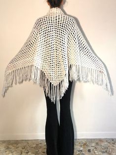 Lovely boho beauty fringe-tactic hand knit crochet triangular scarf from the 1970's. Hand crochet by a talented knitter this scarf is perfect for keeping you warm and bringing some light to the dark winter days. I love a white scarf in the dreary winter! Hand crochet in a wonderful open knit pattern. Wear this at the beach in winter, in front of a fire during chilly spring nights and for keeping warm at a festival. Great Stevie Nicks style. Yarn is soft and fluffy. No labels. I think that the ya Bohemian Open Knit Shawl, Bohemian Crochet Shawl In Acrylic Yarn, Bohemian Knitted Shawl, Bohemian Knitted Shawl One Size, One Size Bohemian Knitted Shawl, Bohemian One-size Knitted Shawl, 1970 Crochet, Beach In Winter, Stevie Nicks Style