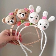 crochet bunny headbands with four bunnies on top, and three bears in the middle