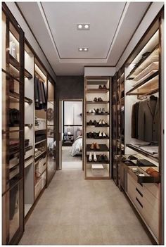 an empty walk in closet with lots of shoes