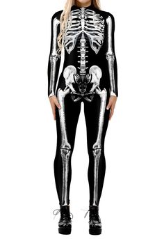 a woman in black and white skeleton costume