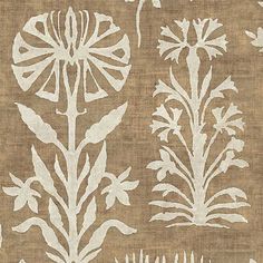 a brown and white fabric with flowers on it