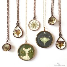 six different necklaces with pictures of animals in them