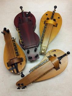 four musical instruments sitting on top of a table