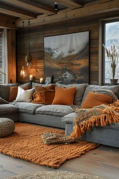 a living room filled with lots of furniture and decor on top of a wooden floor