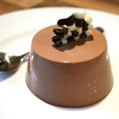 a small chocolate dessert on a white plate