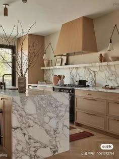 a kitchen with marble counter tops and wooden cabinets, along with an island in the middle