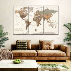 a living room filled with furniture and a large map on the wall above it's couch