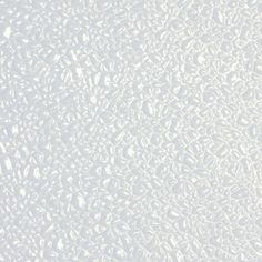 an abstract white background with lots of small speckles