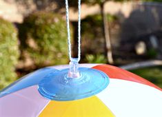 a multicolored umbrella hanging from a string