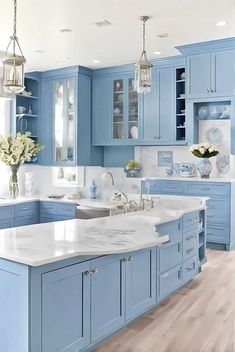 a kitchen with blue cabinets and white counter tops