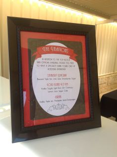 a framed certificate is displayed on a table