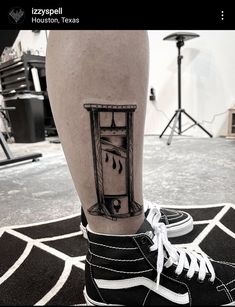 a person with a tattoo on their leg