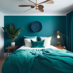 a bedroom with teal walls and white bedding