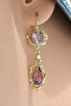 Lady Shalott 14k Gold, Amethyst and Pearl Earrings Elegant Lavender Hallmarked Jewelry, Ornate Purple Jewelry With Matching Earrings, Magnificent Century Jewelry, Ornate Historical Drop Earrings Jewelry, Ornate Purple Gemstone Jewelry, Elegant Purple 14k Gold Earrings, Victorian Amethyst Gemstone Jewelry, Ornate Purple Pierced Earrings, Ornate Gemstone Drop Earrings