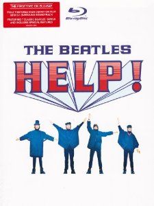 the beatles help logo with their arms up and hands in the air, while they are standing