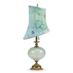 a green lamp with a blue shade on it's base and a white background