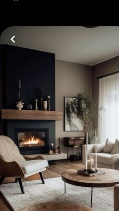 a living room filled with furniture and a fire place in the middle of the room