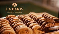 a close up of some breads on a table with a knife in the middle