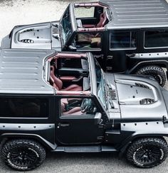 three black and silver jeeps parked next to each other