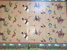 an old rug is decorated with cartoon characters on horses and people in the wild west