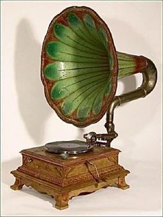 an old record player with a green and red design on it