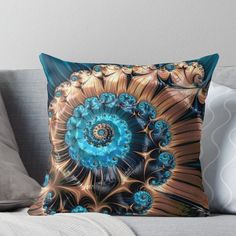 a blue and gold flower on a white background throw pillow