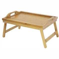 a wooden tray with handles and legs