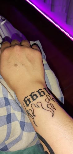 a person with a tattoo on their arm