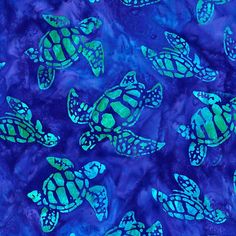 a blue and green tie dyed fabric with sea turtles on it