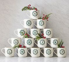 a stack of coffee mugs sitting on top of a counter