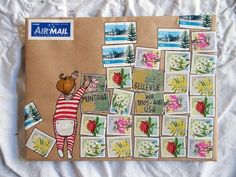 an air mail envelope with stamps on it and a drawing of a girl in striped shirt