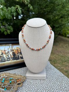 The Buckaroo Necklace *17 1/2" with a 2" extender *4mm Torpedo/Melon beads *6mm Saucers *Spiny Oyster *Sterling Silver hardware *Stainless steel extender -This is made with sterling silver including the Navajo Pearls.  *This listing is for one necklace. Southwestern Orange Round Bead Necklaces, Southwestern Orange Round Beads Necklace, Southwestern Orange Beaded Necklace, Southwestern Orange Round Bead Jewelry, Southwestern Orange Round Beads Jewelry, Navajo Pearls, Spiny Oyster, Western Jewelry, Silver Hardware